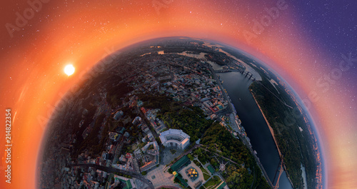 Fototapeta Naklejka Na Ścianę i Meble -  A big 180 degrees panorama of the city of Kiev over the St. Michael's Golden-Domed Monastery at sunset and starry sky. A modern metropolis in the center of Europe against the backdrop of sunset sky