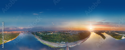 Automobile and subway bridge in Kiev, the capital of Ukraine. Bridge at sunset across the Dnieper River. Kiev bridge against the backdrop of a beautiful sunset in Kiev. Bridge in evening sunshine. A