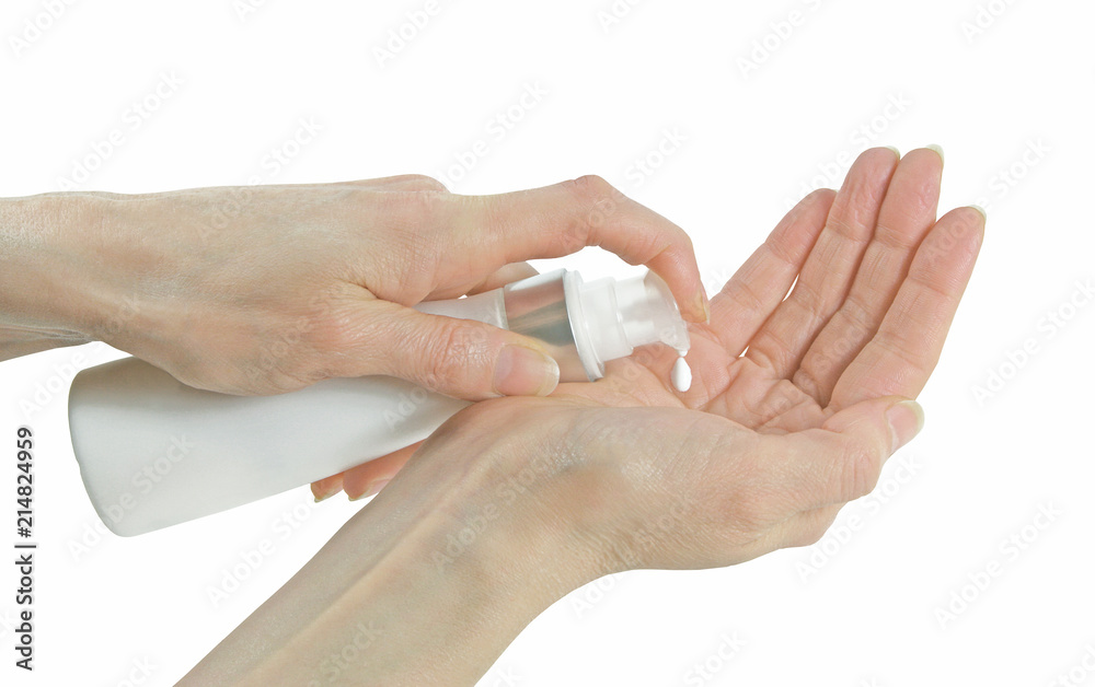 Gentle natural skin care for ageing skin - mature female hands dispensing hand cream into palm isolated on a white background
Gentle natural skin care for ageing skin - mature female hands dispensing hand cream into palm isolated on a white background