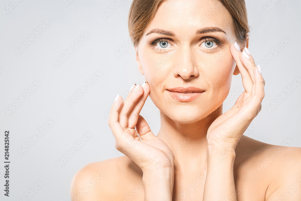 Beauty Woman face Portrait. Beautiful Spa model Girl with Perfect Fresh Clean Skin. Blonde female looking at camera. Youth and Skin Care Concept Beauty Woman face Portrait. Beautiful Spa model Girl with Perfect Fresh Clean Skin. Blonde female looking at camera. Youth and Skin Care Concept