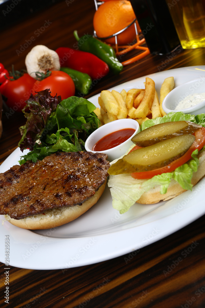 Open burger with lettuce leaves Open burger with lettuce leaves
