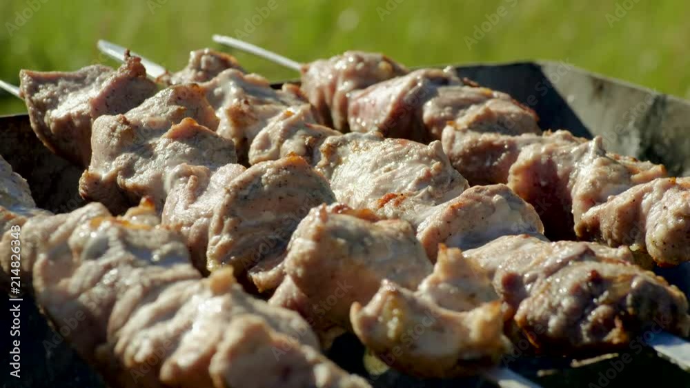 Marinated shashlik preparing on a barbecue grill over charcoal. 4K Marinated shashlik preparing on a barbecue grill over charcoal. 4K
