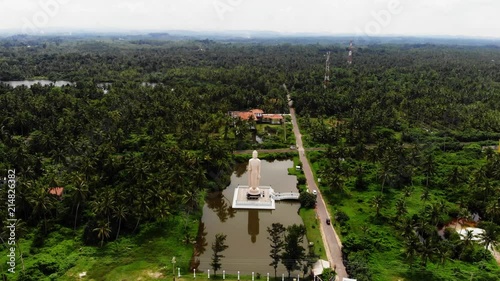 Aerial view from shot Peraliya Buddha Statue, the Tsunami Memorial in Hikkaduwa, Sri Lanka 4k photo