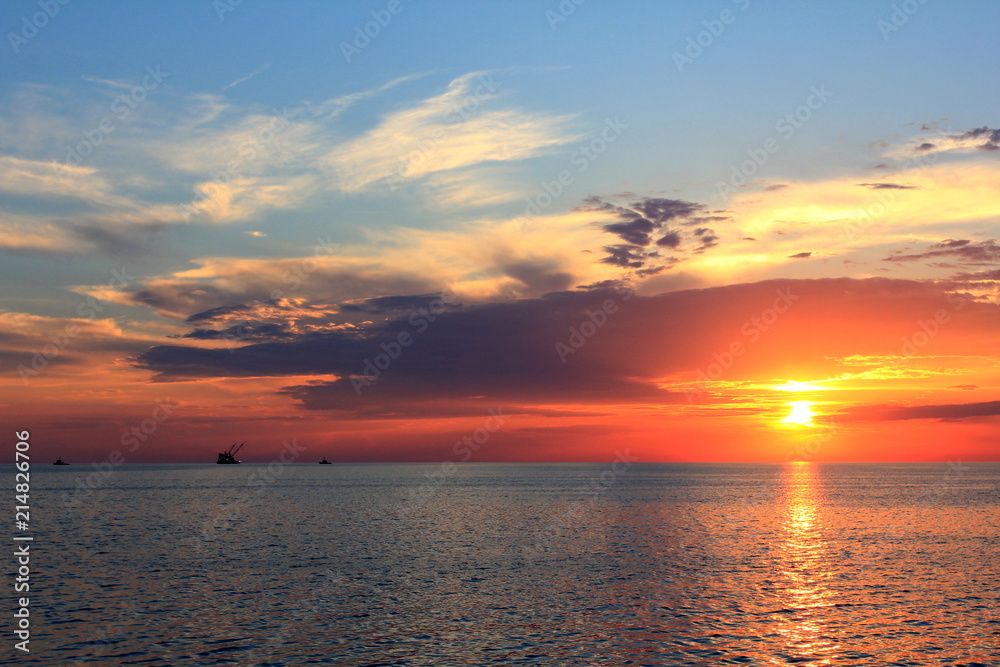 gold sunset, blue sea