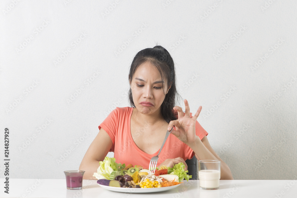 Woman does not like vegetable. Unhappy woman does not like healthy food, Emotional face. Woman does not like vegetable. Unhappy woman does not like healthy food, Emotional face.