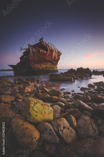 Beautiful landscape photo of the Meisho Maru Shipwreck along the Agulhas Coast at the Southern Most tip of Africa and South Africa photo