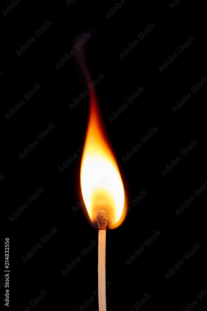 Match on fire on a black background Match on fire on a black background