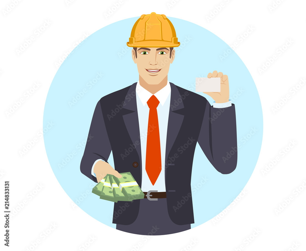 Businessman in construction helmet with money showing the business card Businessman in construction helmet with money showing the business card