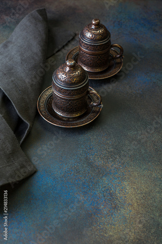 Turkish Coffee on the Dark Background Retro Style Two Bronze Cups