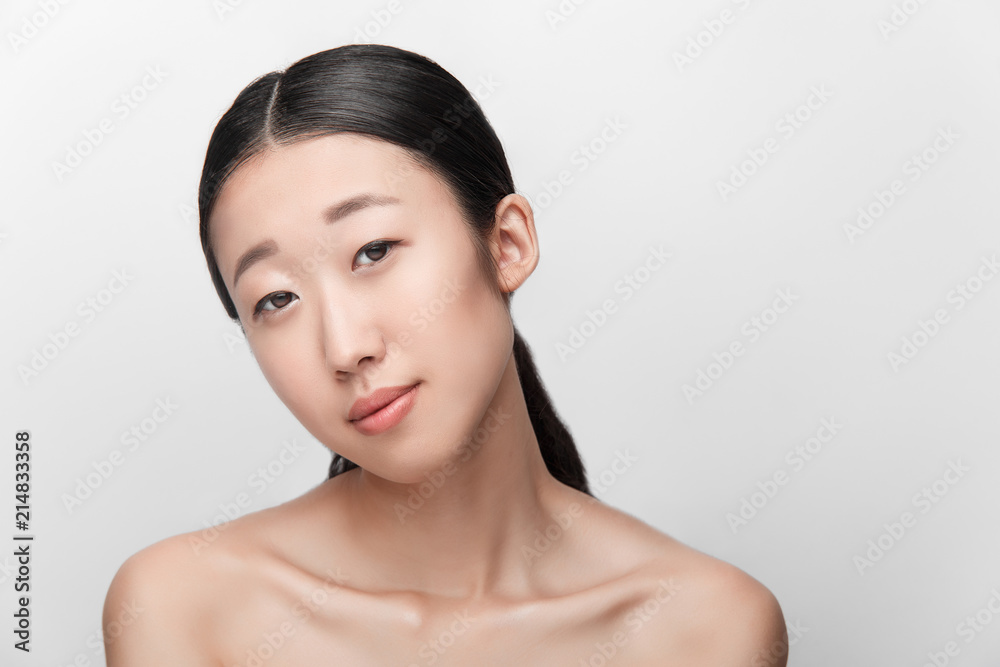 Close up of beauty portrait of beautiful Asian half naked woman isolated on white background Close up of beauty portrait of beautiful Asian half naked woman isolated on white background