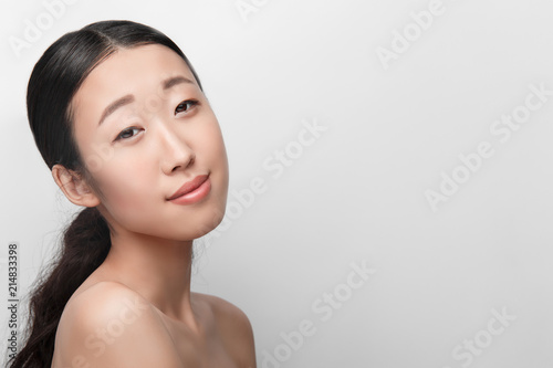Close up of beauty portrait of beautiful Asian half naked woman isolated on white background