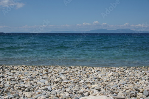 View of empty beach, sea and clear sky