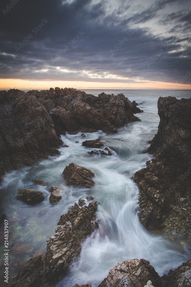 Beautiful sunset over the sandstone cliffs along the coastline of De Kelders in Gansbaai in the Overberg of south africa