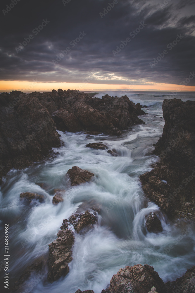 Beautiful sunset over the sandstone cliffs along the coastline of De Kelders in Gansbaai in the Overberg of south africa Beautiful sunset over the sandstone cliffs along the coastline of De Kelders in Gansbaai in the Overberg of south africa