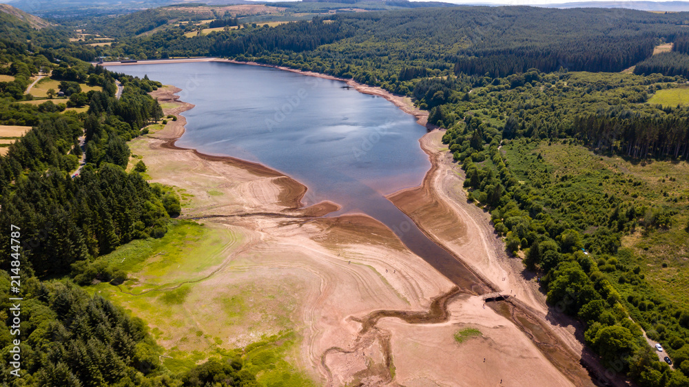 Aerial drone view of a drying reservoir in Wales during a heatwave (Llwyn-On Reservoir) Aerial drone view of a drying reservoir in Wales during a heatwave (Llwyn-On Reservoir)