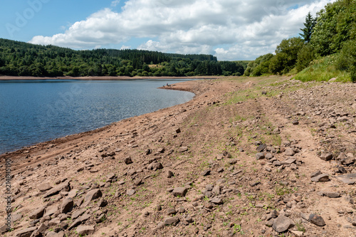 A near dry reservoir in the UK caused by drought and a heat wave ( Llwyn-On Reservoir)