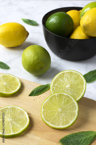lemons and limes on a cutting board