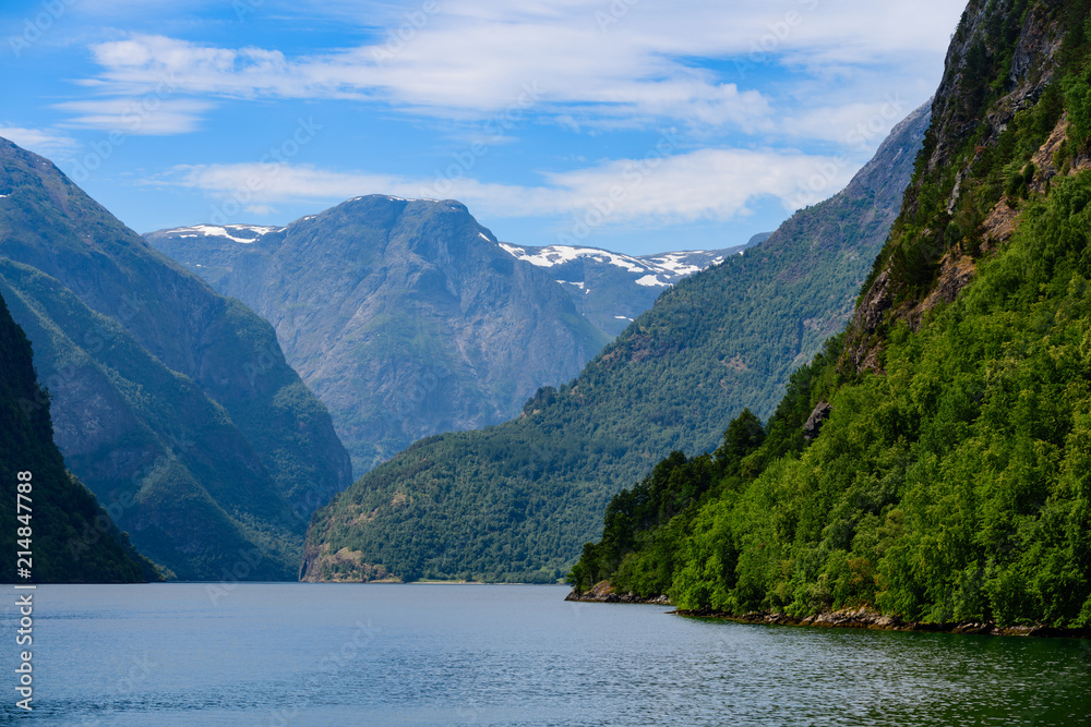 Magnificent fjord landscape with a trace from the boat. Neroyfjord offshoot of Sognefjord is the narrowest fjord in Europe. Norway, Europe.
