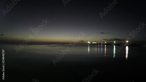 Nightlapse Timelapse Panolapse with colored lights at the coastal seaport area photo