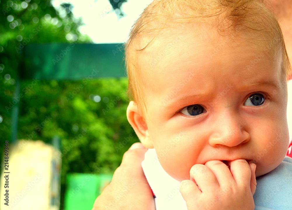 Infant boy close up portrait outdoors. Infant boy close up portrait outdoors.