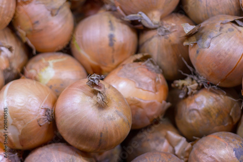 An isolated group of brown onions for sale