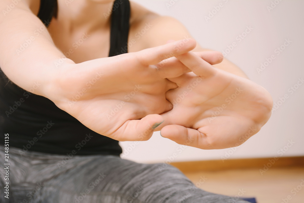 Close up view of woman doing exercise indoors