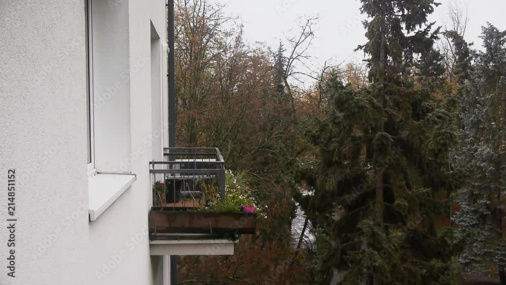 Wide angle view of a balcony overlooking Park Maszalka in Warsaw, Poland on a cold, rainy autumn day Wide angle view of a balcony overlooking Park Maszalka in Warsaw, Poland on a cold, rainy autumn day