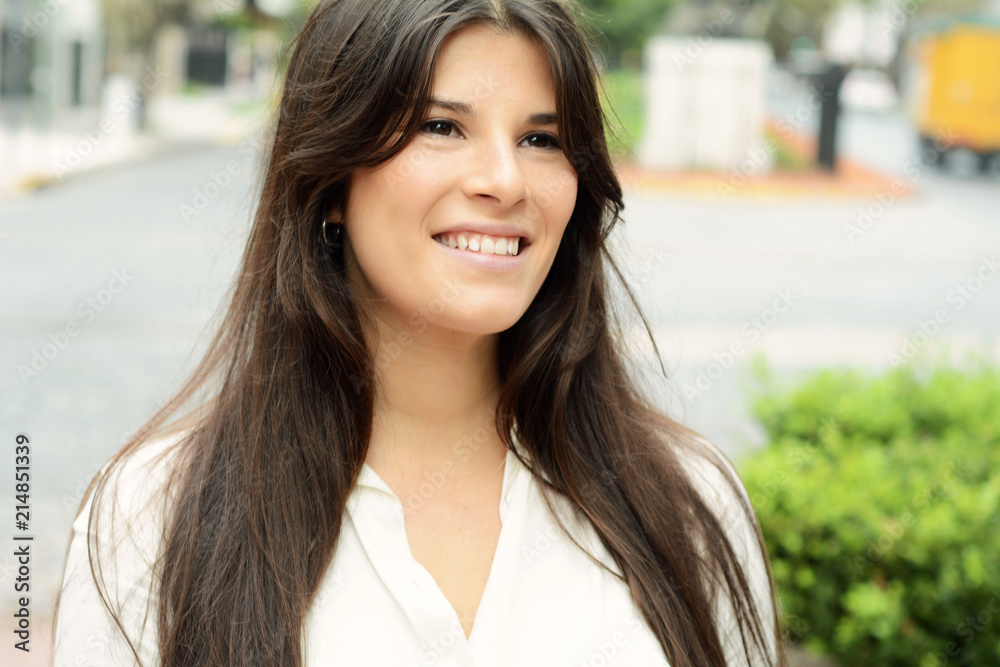 Close up of a young woman outdoors. Close up of a young woman outdoors.