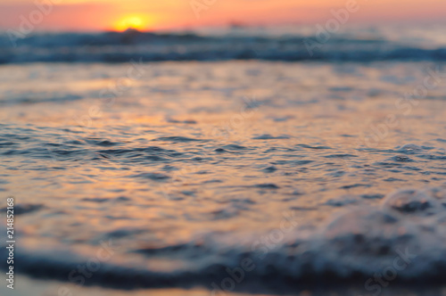 Sunrise in the waves of the sea. Sunset on the sea.