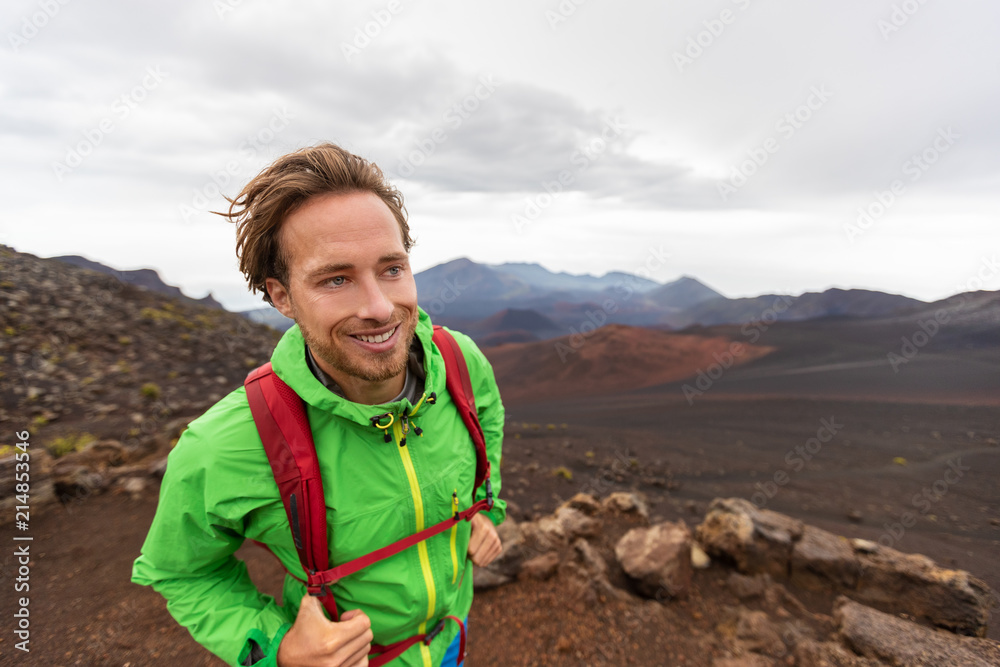 Mountaineer hiker man walking on mountain trail hike in Maui Haleakala crater volcano, Hawaii USA travel lifestyle. Mountaineer hiker man walking on mountain trail hike in Maui Haleakala crater volcano, Hawaii USA travel lifestyle.