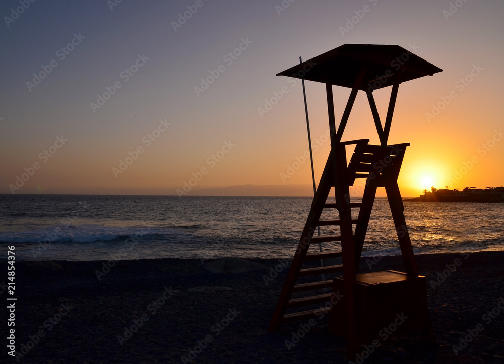 Lifeguard tower on the beach at sunset in Tenerife,Canary islands,Spain. Lifeguard tower on the beach at sunset in Tenerife,Canary islands,Spain.