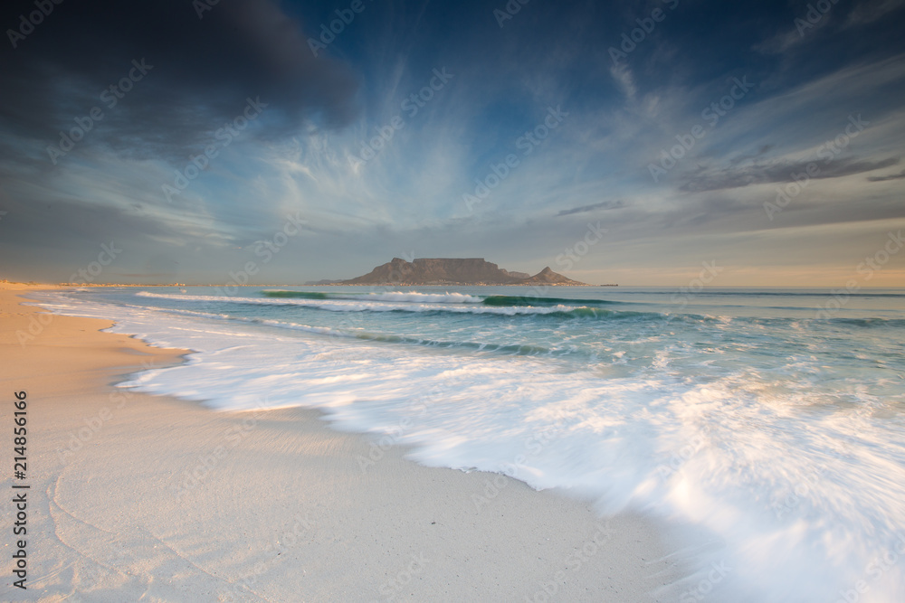 Naklejka premium Stunning clouds over Table Mountain in Cape Town South Africa,as seen from blouberg beach, one of the top holiday destinations in the world