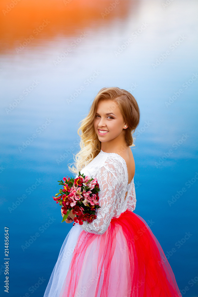 beautiful gentle girl with a bouquet of flowers in nature beautiful gentle girl with a bouquet of flowers in nature