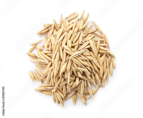 Raw oats on white background. Healthy grains and cereals