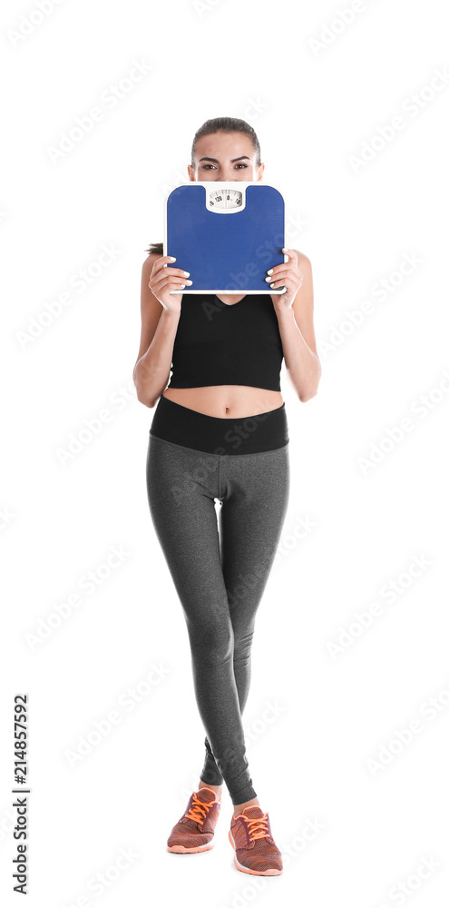 Happy young woman with scales on white background. Weight loss motivation Happy young woman with scales on white background. Weight loss motivation