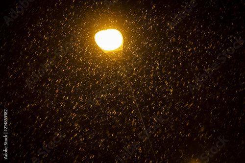 public lamp with rain sprinkling at night