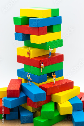 Miniature people   Group Athletes climb on color block wooden. Image use for Activities  travel  business concept.
