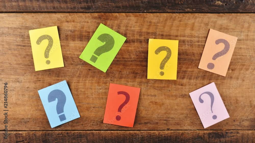 4K Stop Motion - group of colorful paper with QUESTION MARK vibrating on a wooden table. Concept of FAQ, Questions, Q&A and problems 4K Stop Motion - group of colorful paper with QUESTION MARK vibrating on a wooden table. Concept of FAQ, Questions, Q&A and problems