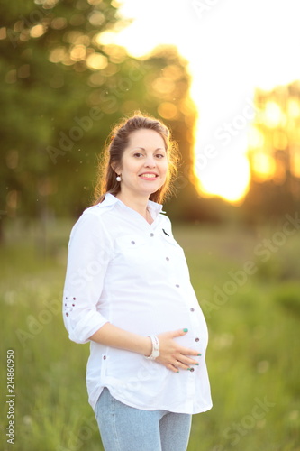 portrait of beautiful pregnant woman on a walk in the Park