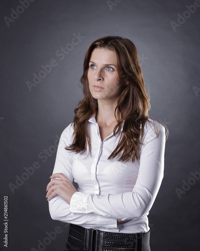 portrait of a focused business woman isolated on a dark background