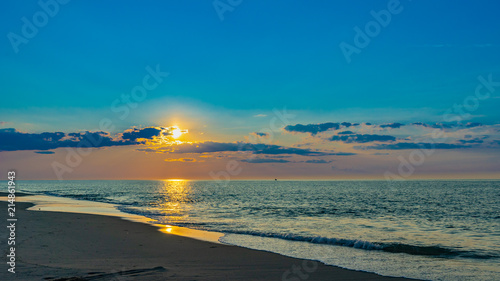 Sunset on the beach on north side of the Provincelands Cape Cod, Atlantic ocean view MA US.