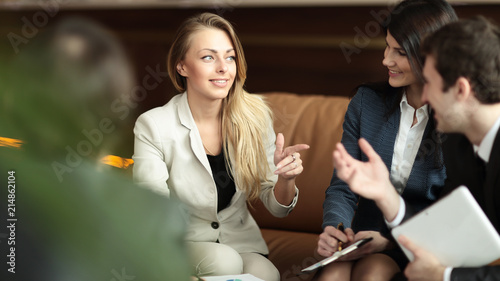 business woman talking to her business team