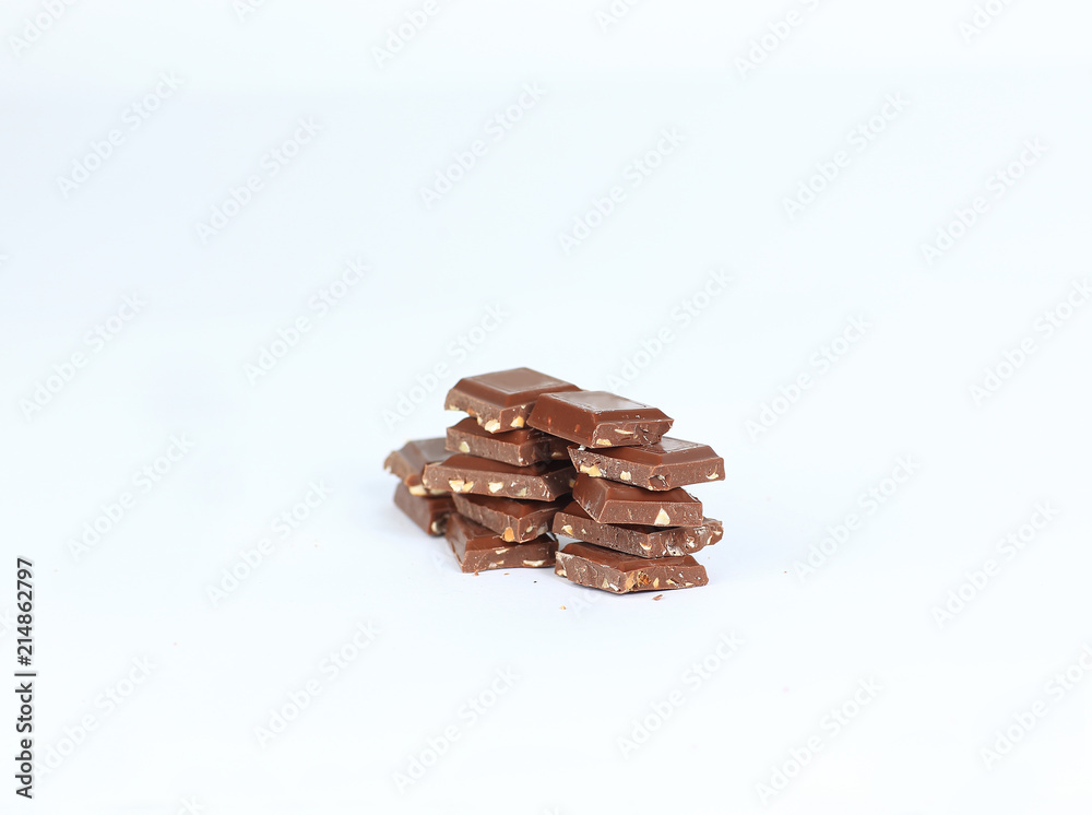 pieces of dark chocolate with nuts isolated on white.photo with copy space pieces of dark chocolate with nuts isolated on white.photo with copy space