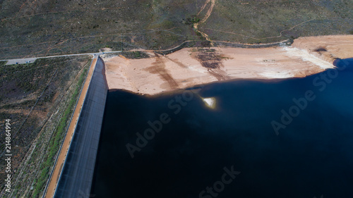 Aerial view over the Bergriver dam in the Bergriver outside Franschhoek in the western cape during the worst drought in decades in South Africa photo