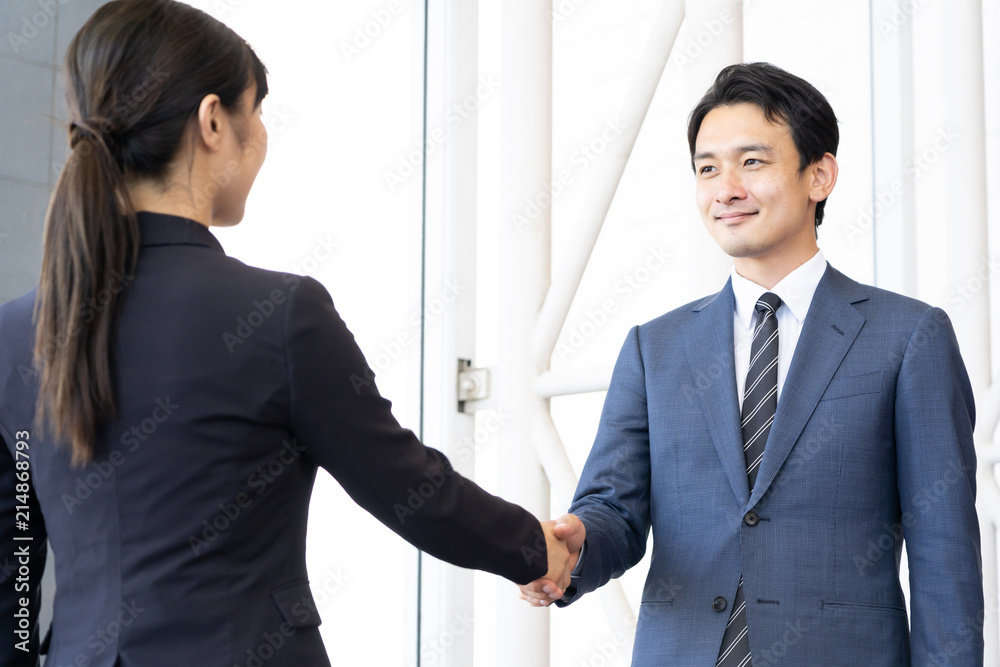 asian business team shaking hands