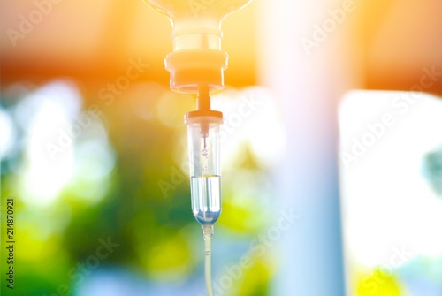 Set iv fluid intravenous drop saline drip hospital room,Medical Concept,treatment emergency and injection drug infusion care chemotherapy, concept.blue light background,selective focus  photo