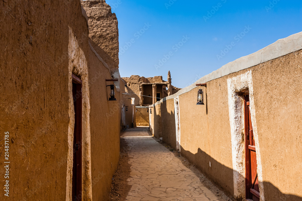 A narrow street in a traditional Arab mud brick village, Al Majmaah, Saudi Arabia