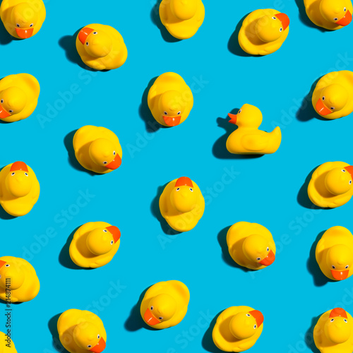 Fotografia One out unique rubber duck concept on a blue background