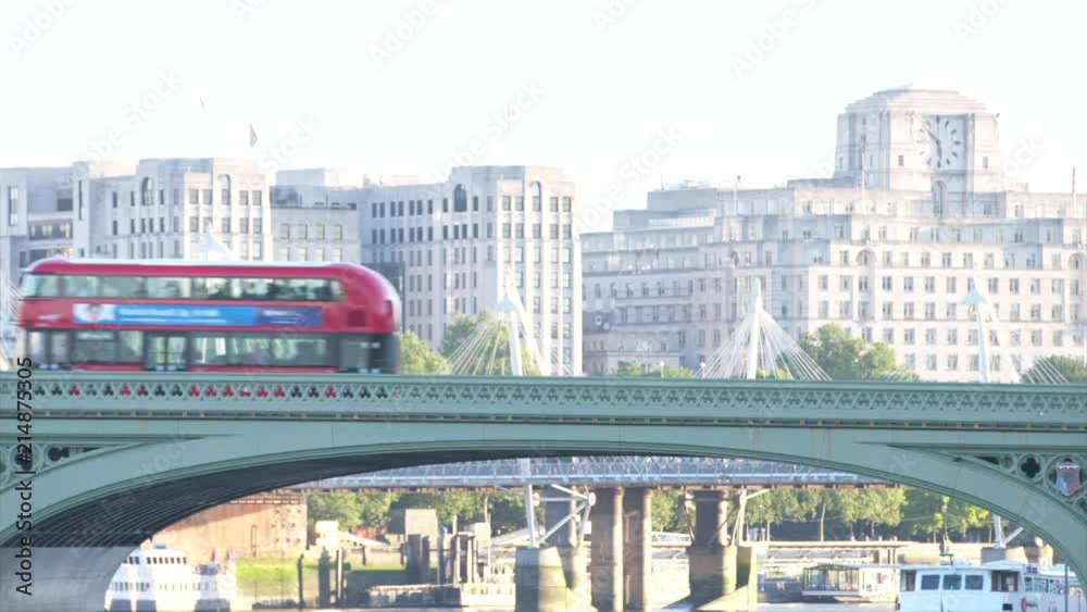 London Red bus passes over bridge