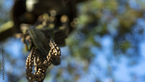 Chains attached to a hook and blurred background © Ranimiro